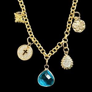 Gold Charm Necklace with Blue Crystal Pendant, Cross, and Bumblebee Charms. NWT